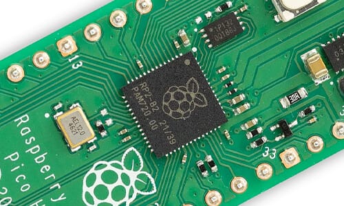 Close-up of a Raspberry Pi Pico board with visible logo.